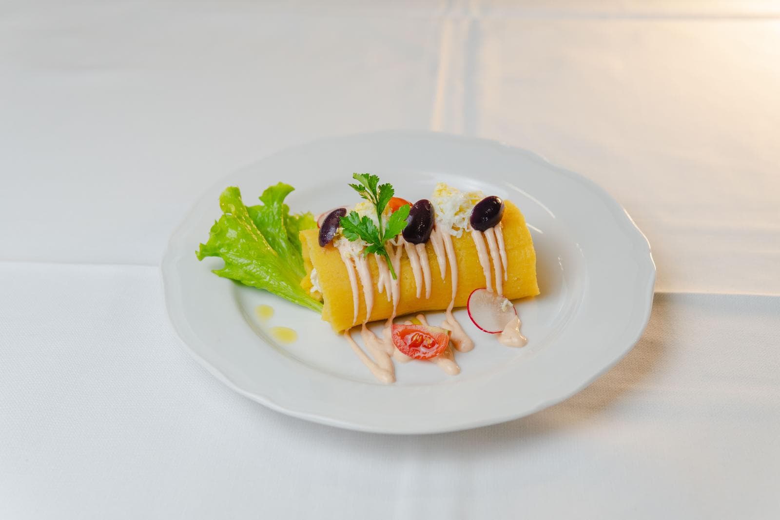 Causa rellena, yellow potato with olives