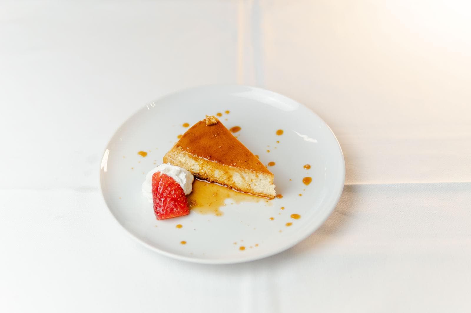 House dessert with caramel and strawberry