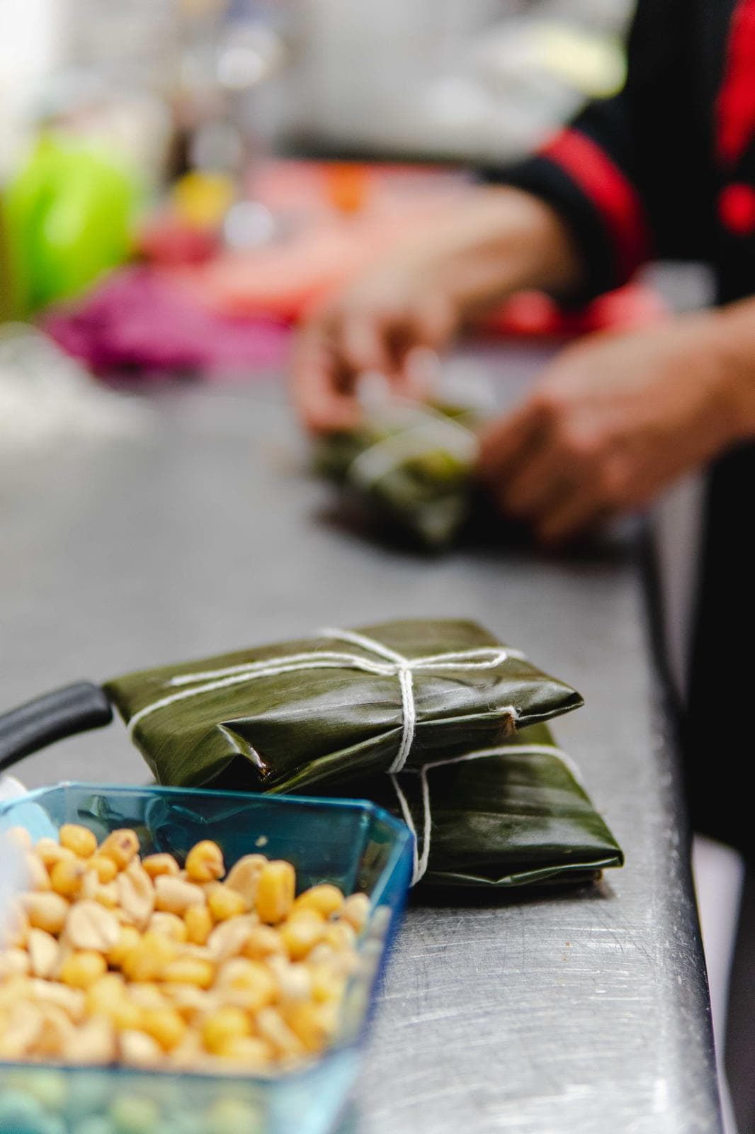 Parcels wrapped in banana leaves, ready to cook
