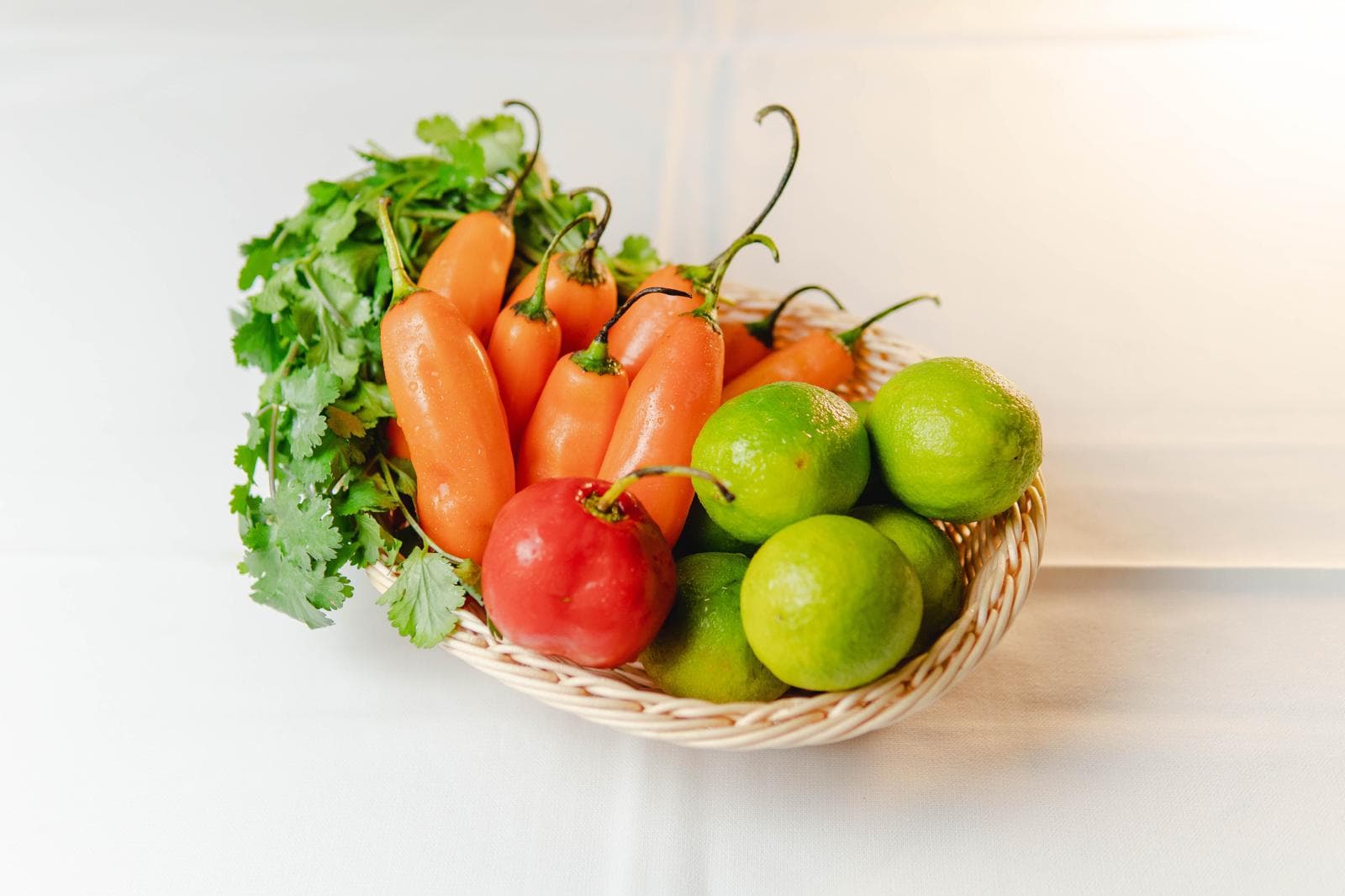 Ají peppers, limes, tomatoes and cilantro