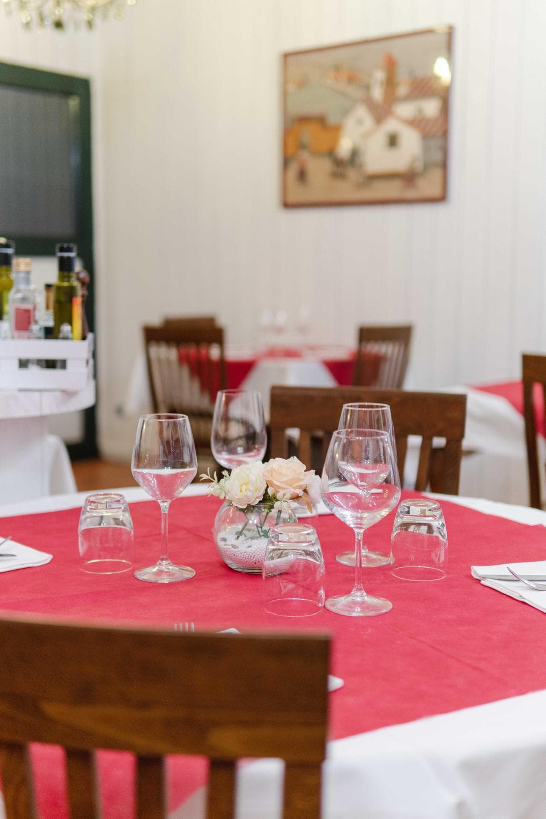 A table set with glasses and flowers
