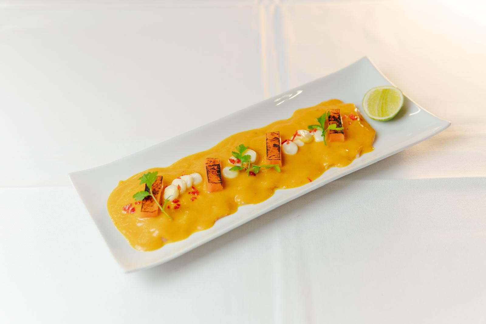 Fish tiradito with ají amarillo sauce